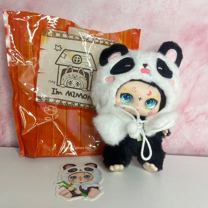 Plush toy in panda costume with packaging and sticker on a pink background