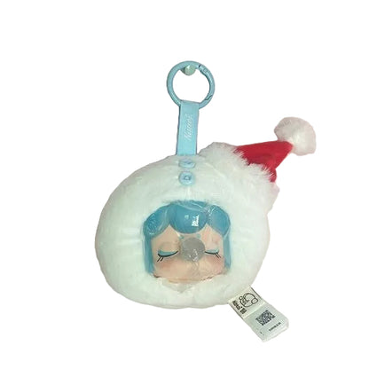 Plush keychain with character design on a pink and white marbled background