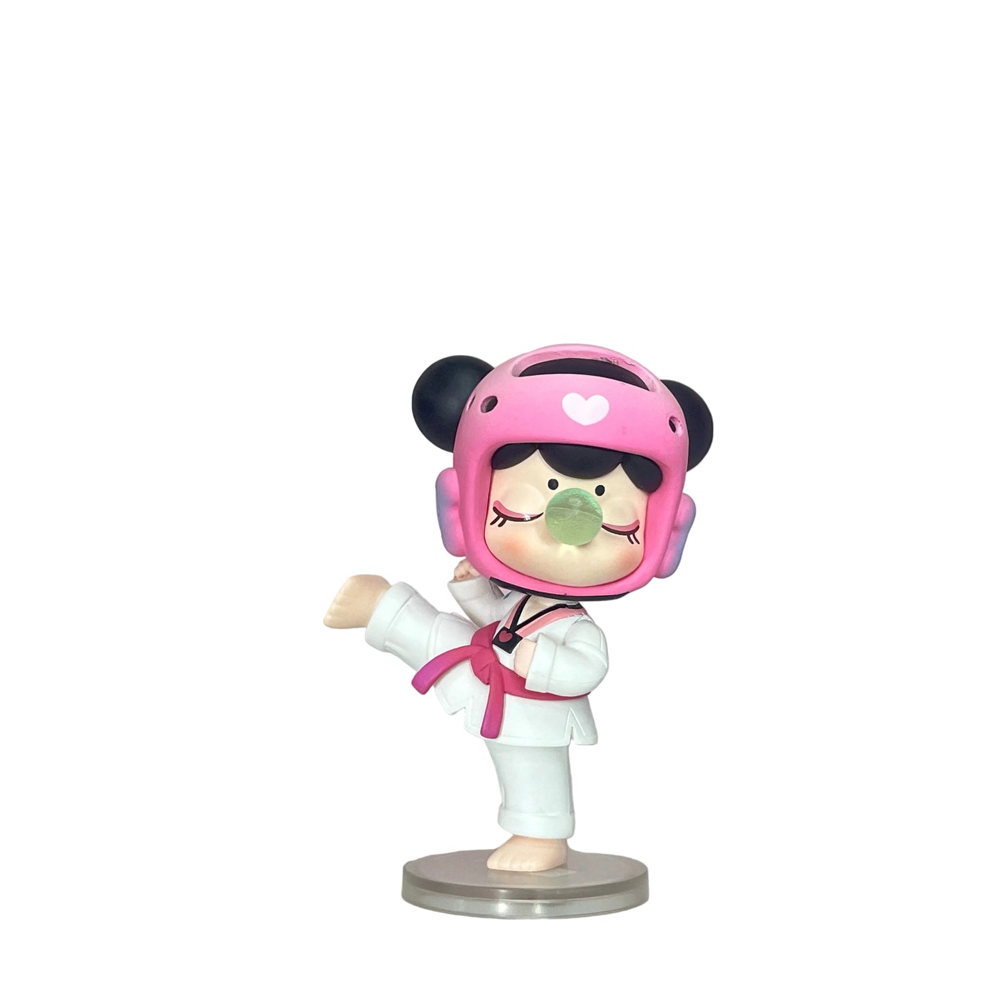 Figurine of a character in a pink helmet and white outfit on a pink and white background