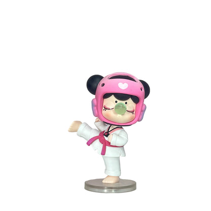 Figurine of a character in a pink helmet and white outfit on a pink and white background
