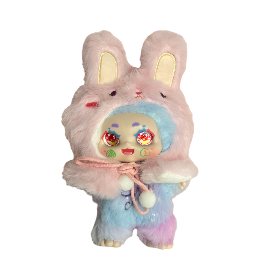 Furry plush toy with bunny ears and colorful face