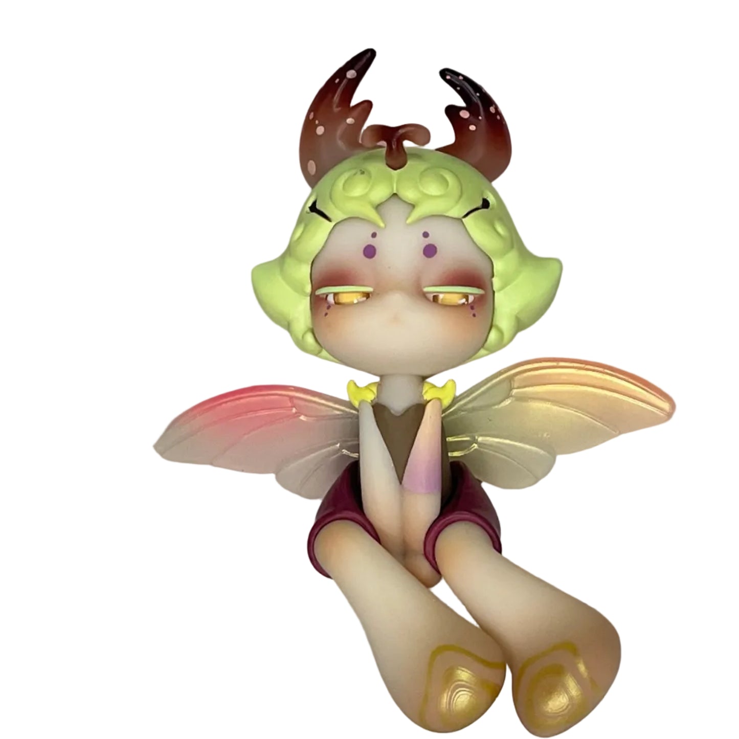 Small figurine with fairy-like design on a pink and white background, featuring the brand 'Rock with Jenny'.